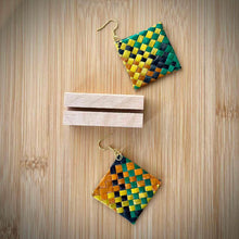 Load image into Gallery viewer, Woven diamond-shaped earrings on a wooden surface