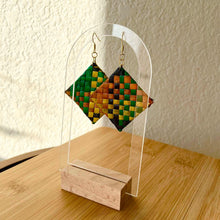 Load image into Gallery viewer, Pair of geometric patterned earrings on a clear acrylic stand with wooden base.
