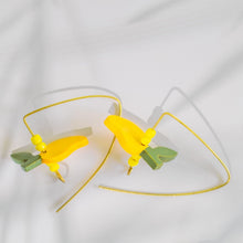 Load image into Gallery viewer, wooden mango fruit earrings on white cloth