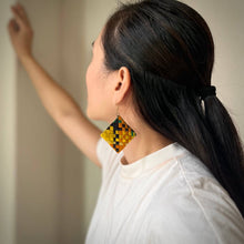 Load image into Gallery viewer, Woman wearing a colorful geometric earring with a blurred background

