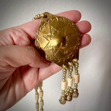 Load image into Gallery viewer, Kulintang-inspired gong pendant necklace celebrating the musical traditions of the Philippines.
