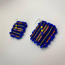 Load image into Gallery viewer, Handmade blue Cordillera fabric earrings shown at an angle highlighting colorful woven details.
